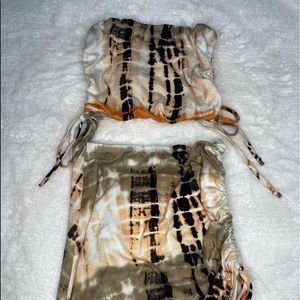 Tie dye runched up tube top and skirt set.